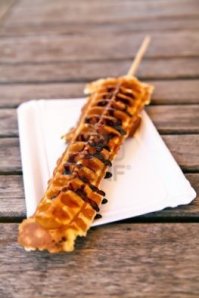 Waffle on a stick drizzled in chocolate, Mmm!
