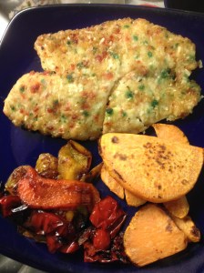 tilapia coated with seasoning and coconut, yams and grilled peppers