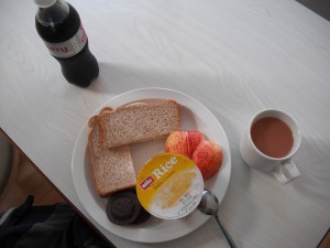My lunch, a turkey and apple sandwich with the rest of the apple on the side, along with a rice pudding cup, two jaffa cookies and of course tea and diet coke lol